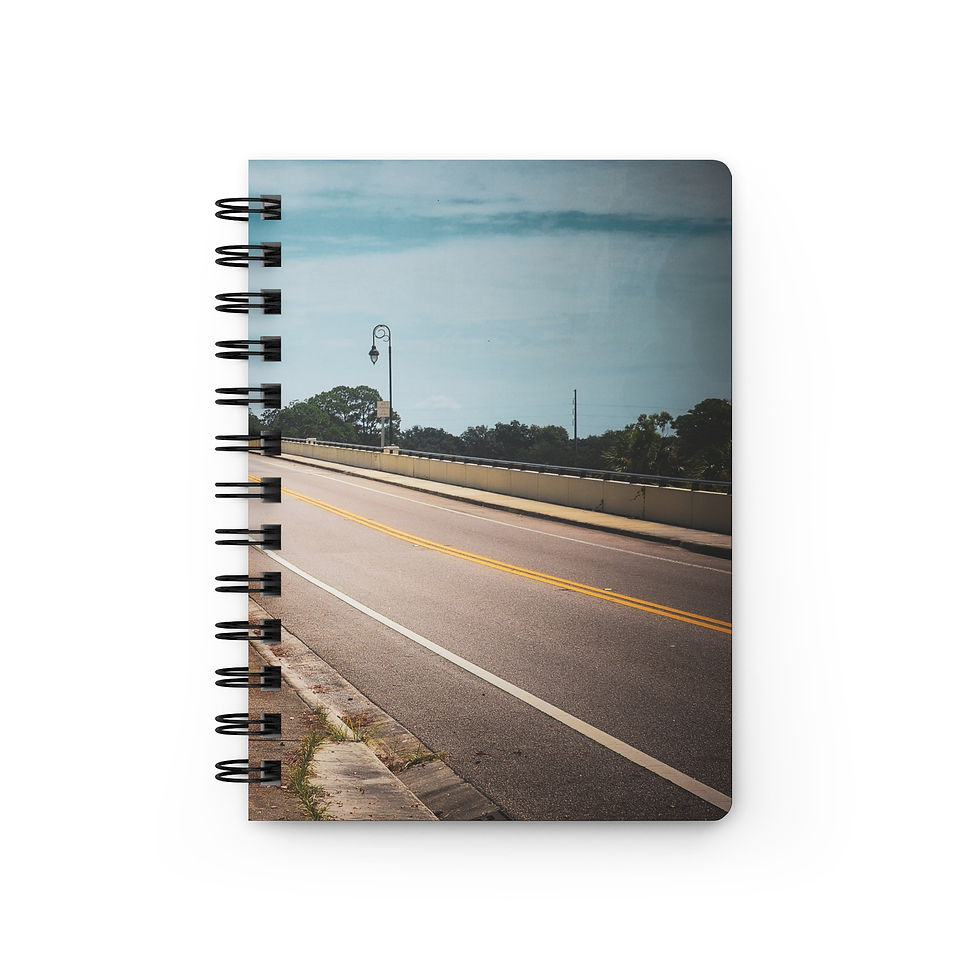 Spiral notebook featuring a scenic road and coastal view cover