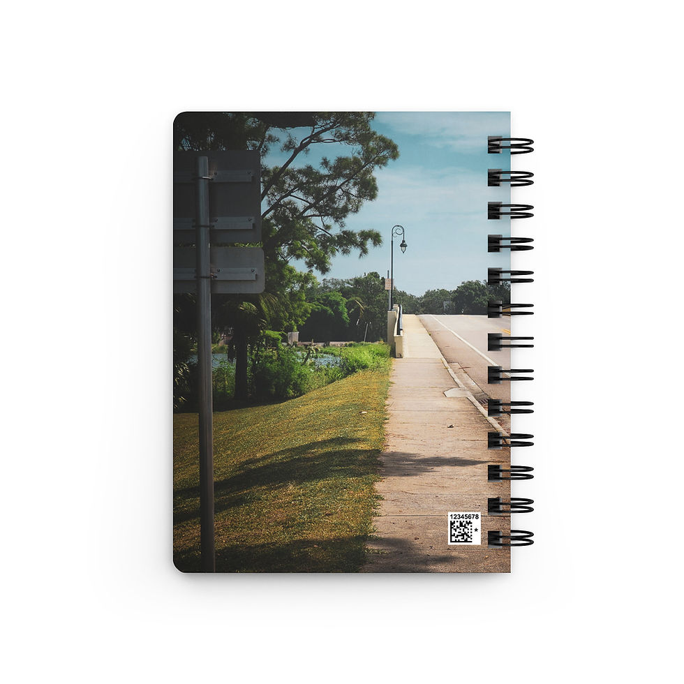 Spiral notebook with a landscape photo of a sunny park path