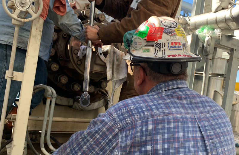 Fuji technician working on plant equipment
