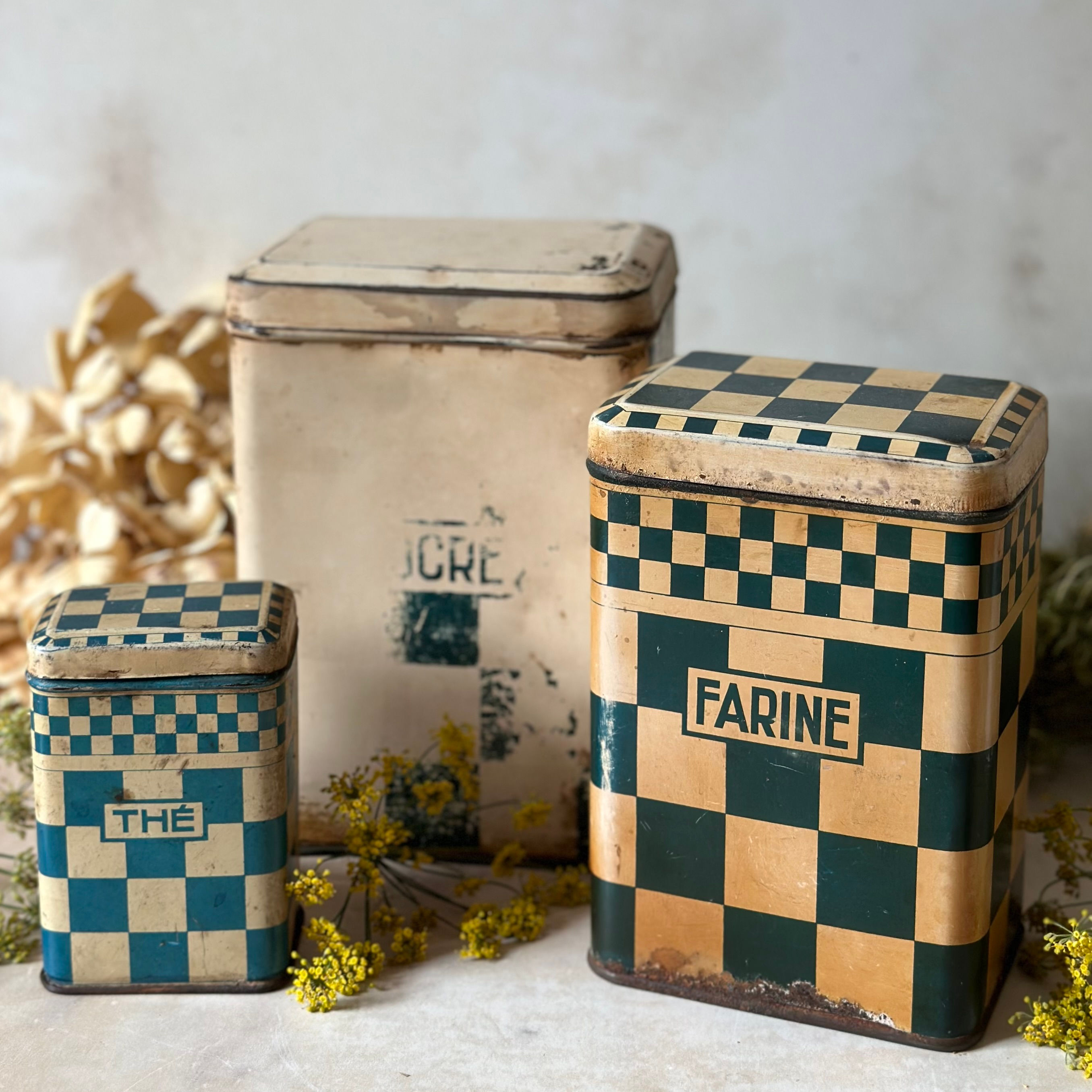 Heavily patinated French kitchen canisters, set of 3