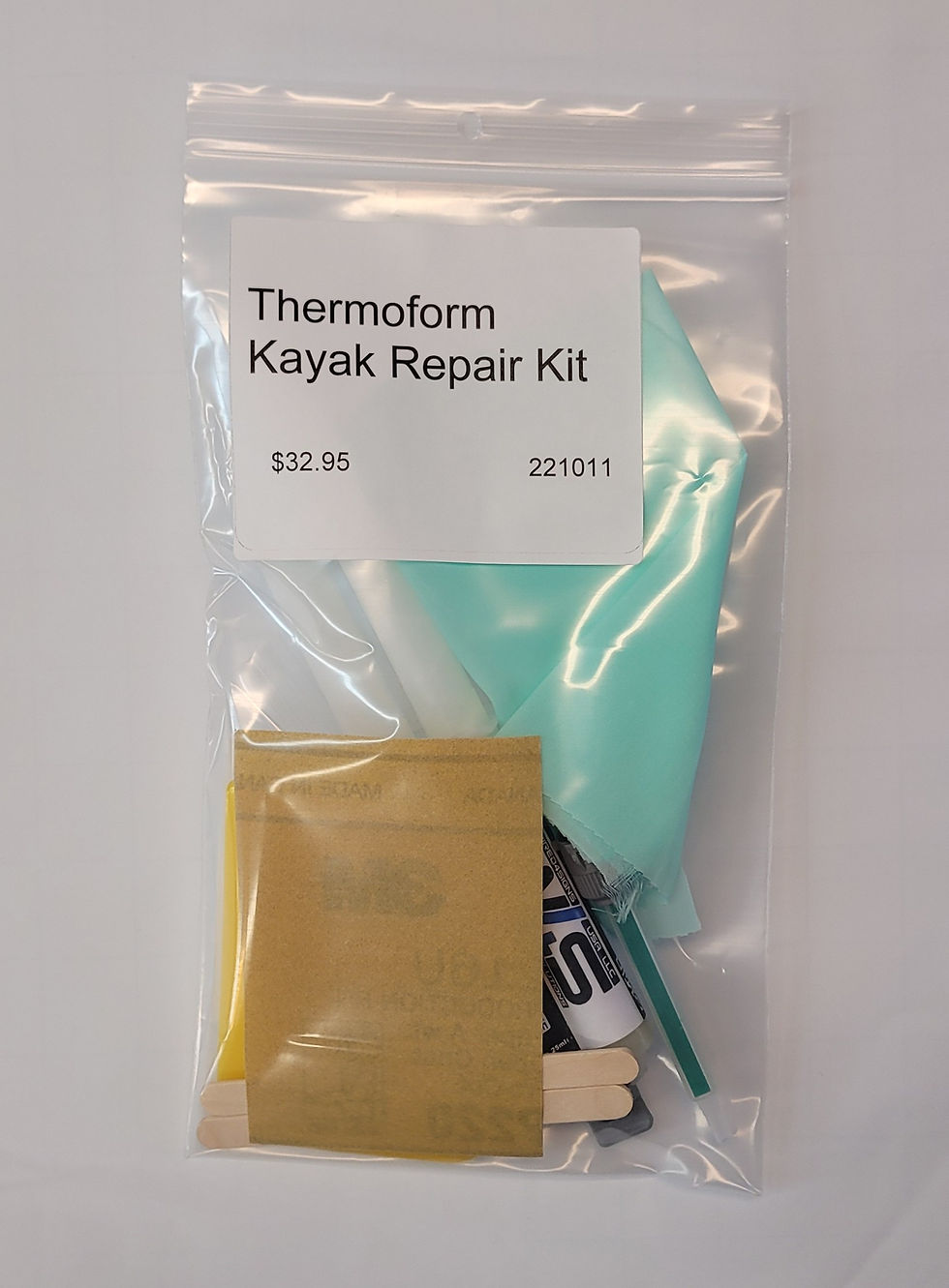 Thermoform kayak repair kit in packaging