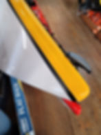 Black Replacement Delta Kayaks Seam Tape on a Yellow and White Kayak Bow