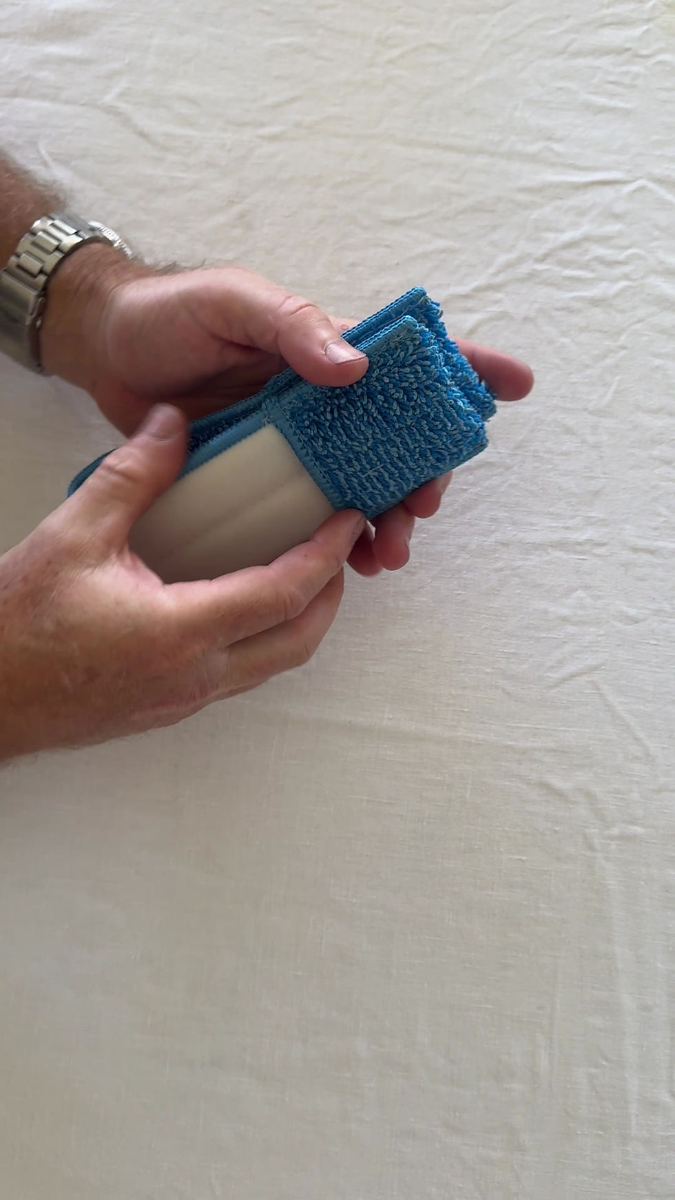Thumbnail: window cleaning louvre mop in someones hands