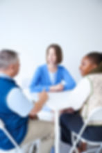 Thrivner employees discussing by a table