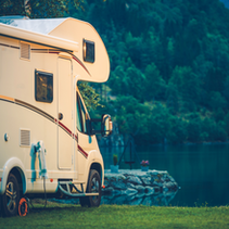RV camper next to lake