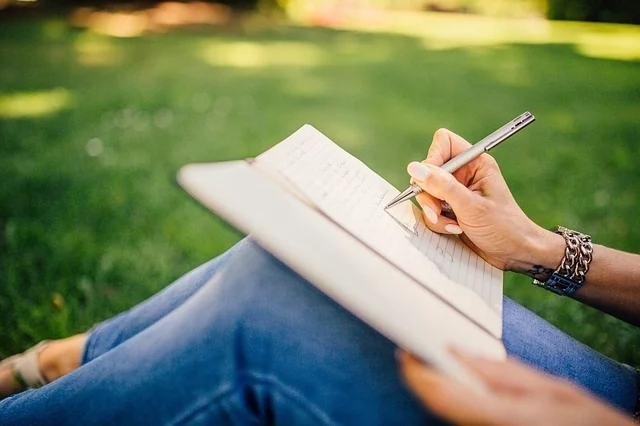 Girl in the park doing the work of Byron Katie