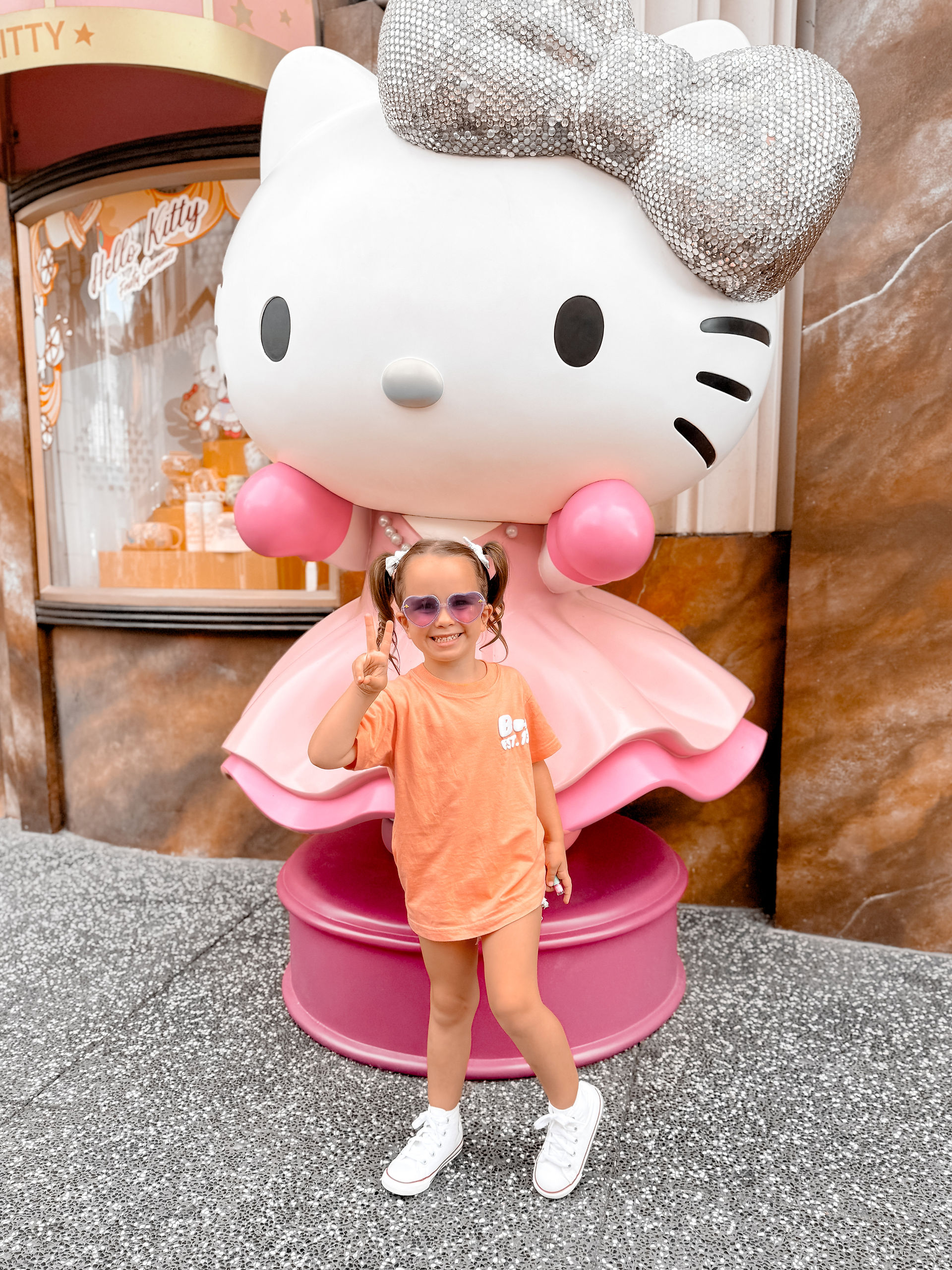 Girl in front of Hello Kitty Statue at Universal Singapore