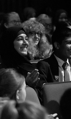 Students applauding speakers at the Ripples of Hope Festival at HOME MCR