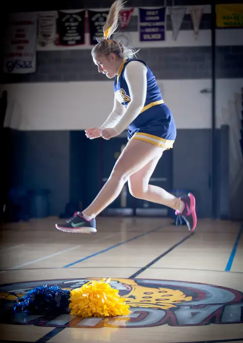 Lifestyle Photography by Blake Ferguson depicts Female Model Shauni Shelly as a Cheerleader, captured on location in the gymnasium of London, Ontario, Canada. (4) 