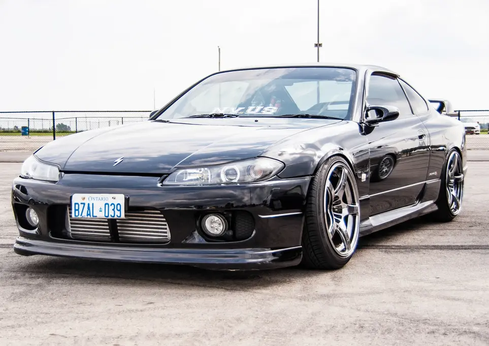 Black Nissan Silvia S15 car, license plate R7A1-039, parked outdoors.