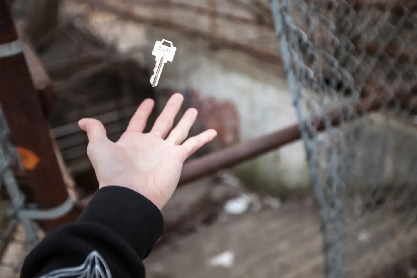 Cityscape & Street Fine-Art Photography by Blake Ferguson demonstrate a levitating key in a graffiti-marked alley in Downtown London, Ontario, Canada. (2)