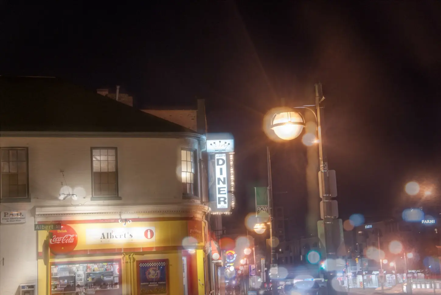 Night & Cityscape Fine-Art Photography by Blake Ferguson depicts Bokeh of Lights surrounding Prince Albert’s Diner of Downtown London, Ontario, Canada.