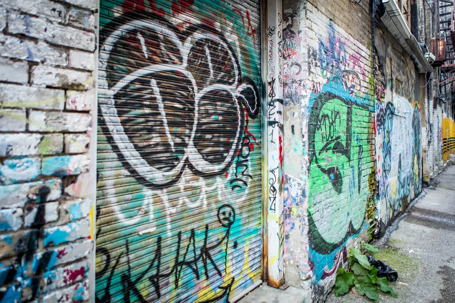 Cityscape & Street Fine-Art Photography by Blake Ferguson demonstrate tag markings through a grunge alleyway in Downtown London, Ontario, Canada.