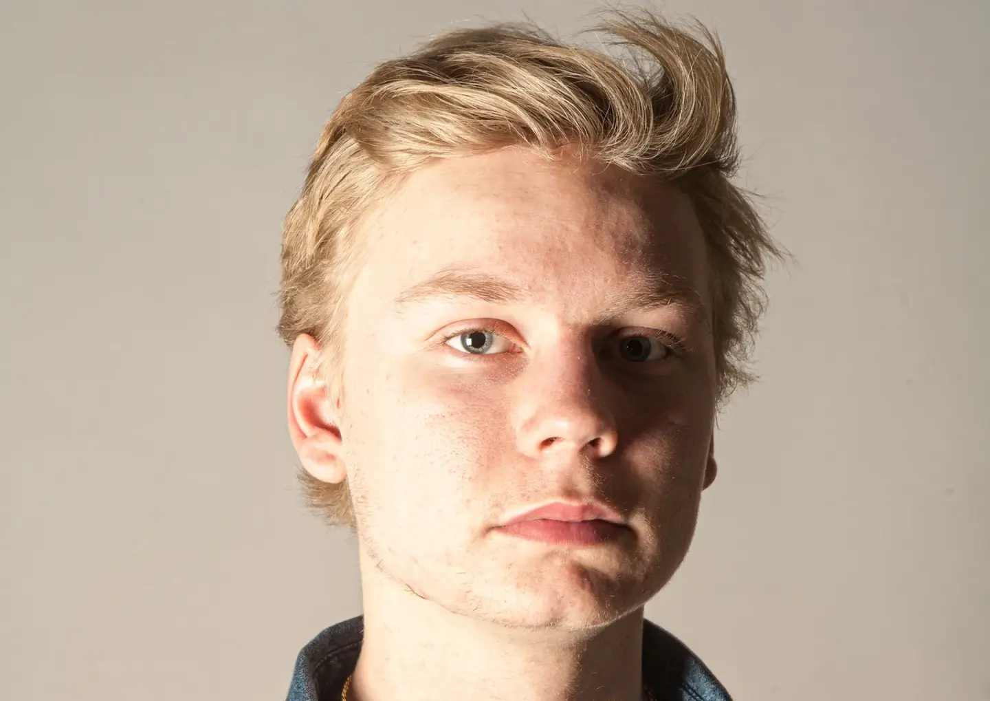 Headshot & Personal Branding Photography by Blake Ferguson depicts a head and shoulders Image of a serious-faced Male Model captured in the Studio.