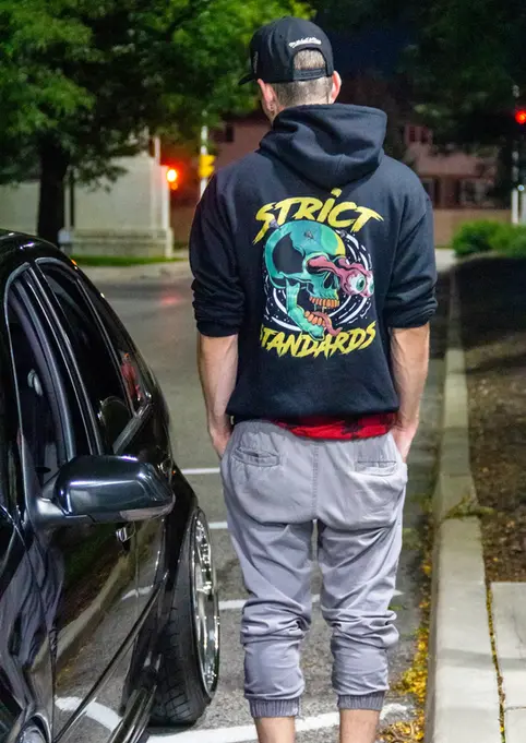 Lifestyle Product Photography in Natural Environment by Blake Ferguson demonstrates Strict Standards Eye-Popping Hoodie Black in the Night of London, Ontario. (3)