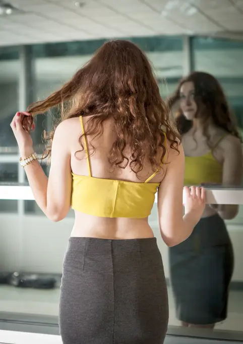 On Location Fashion Photography by Blake Ferguson depicts a Female Model, Jenn Potter, with a provocative attitude and sass-like personality in Fanshawe College, London, Ontario.