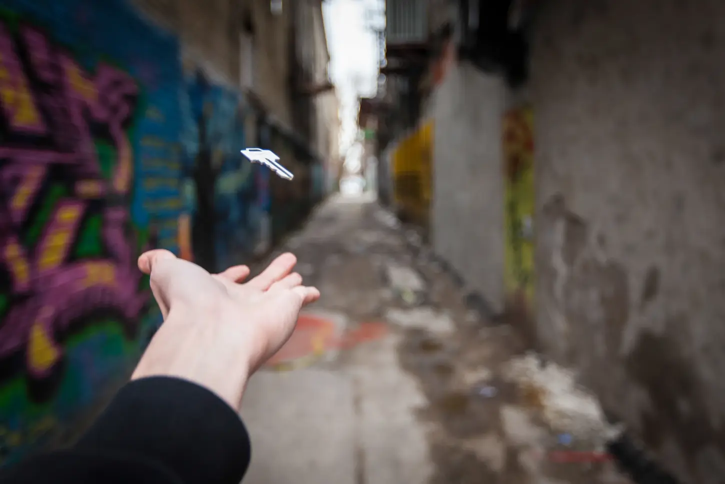 Cityscape & Street Fine-Art Photography by Blake Ferguson demonstrate a levitating key in a graffiti-marked alley in Downtown London, Ontario, Canada (2)