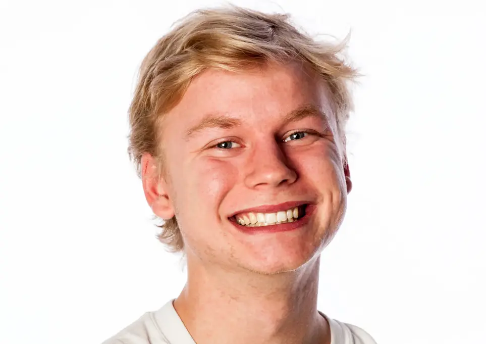 Headshot & Personal Branding Photography by Blake Ferguson depicts a head and shoulders Image of a smiling Male Model captured in the Studio. 