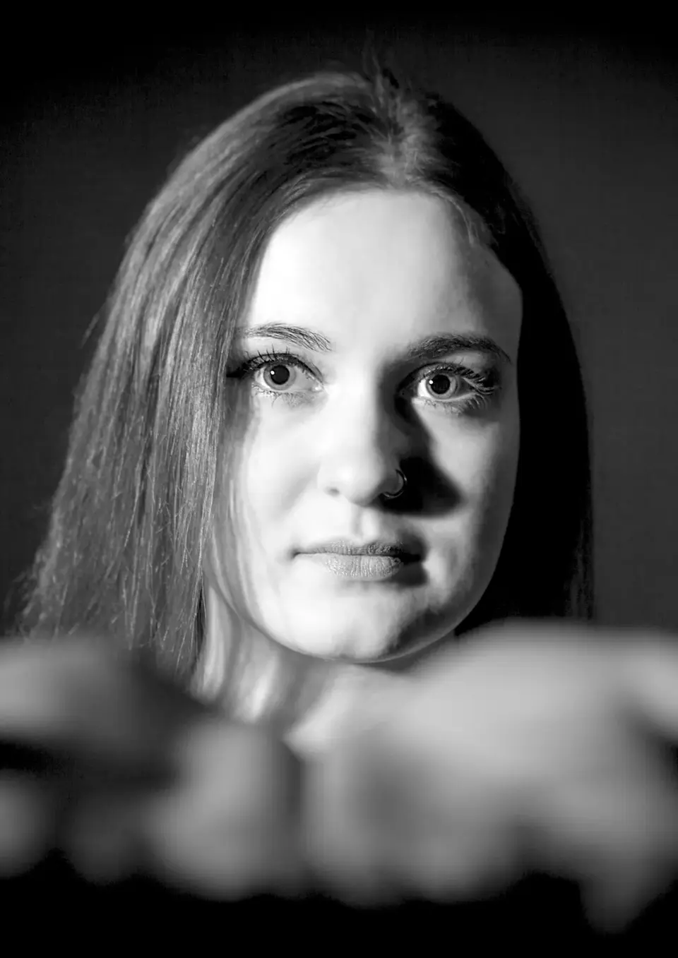 Traditional Portraiture in Monochrome by Blake Ferguson Photography depicts a welcoming face, only an Image of a Female Model captured in the Studio.