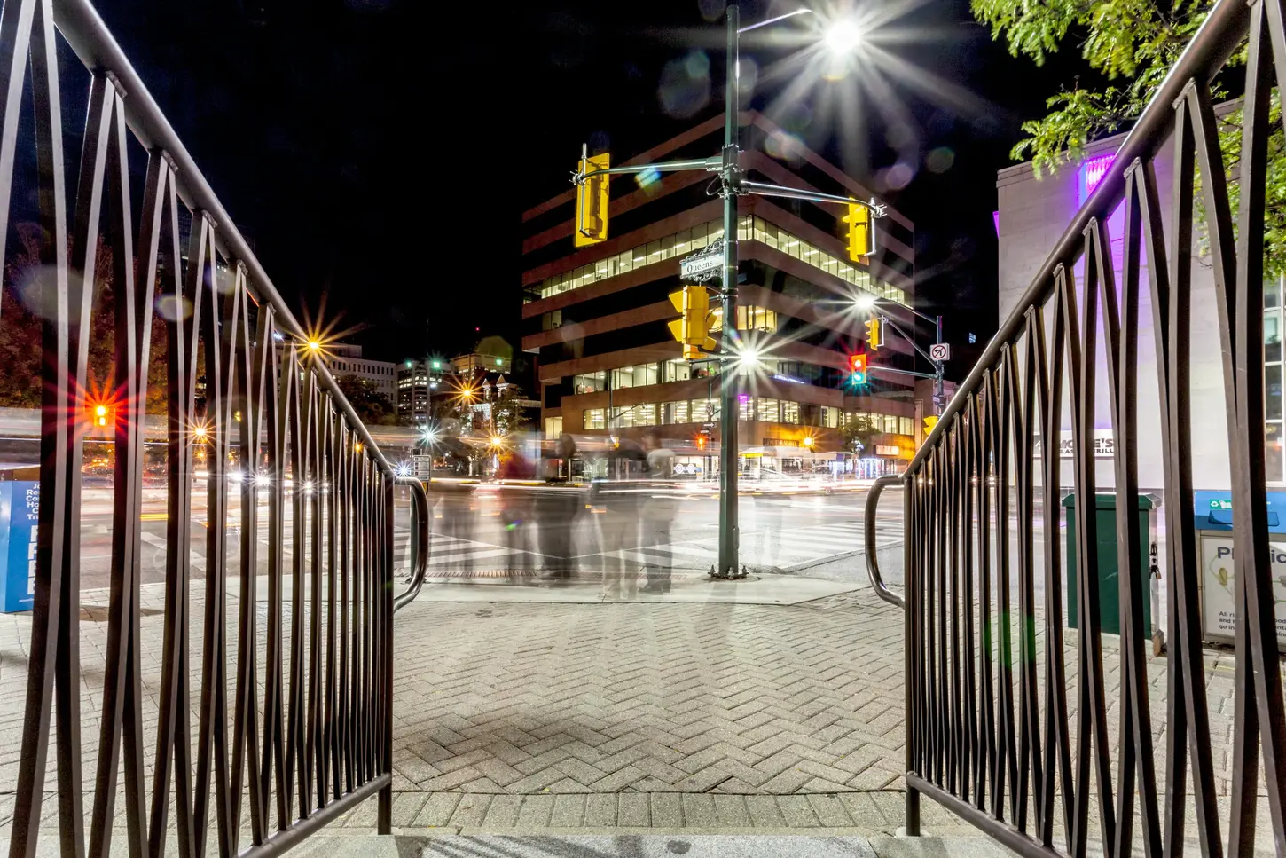 Night & Cityscape Fine-Art Photography by Blake Ferguson depicts slow shutter pedestrian motion looking into the City Street of Downtown London, Ontario, Canada.Night & Cityscape Fine-Art Photography by Blake Ferguson depicts slow shutter pedestrian motion looking into the City Street of Downtown London, Ontario, Canada.