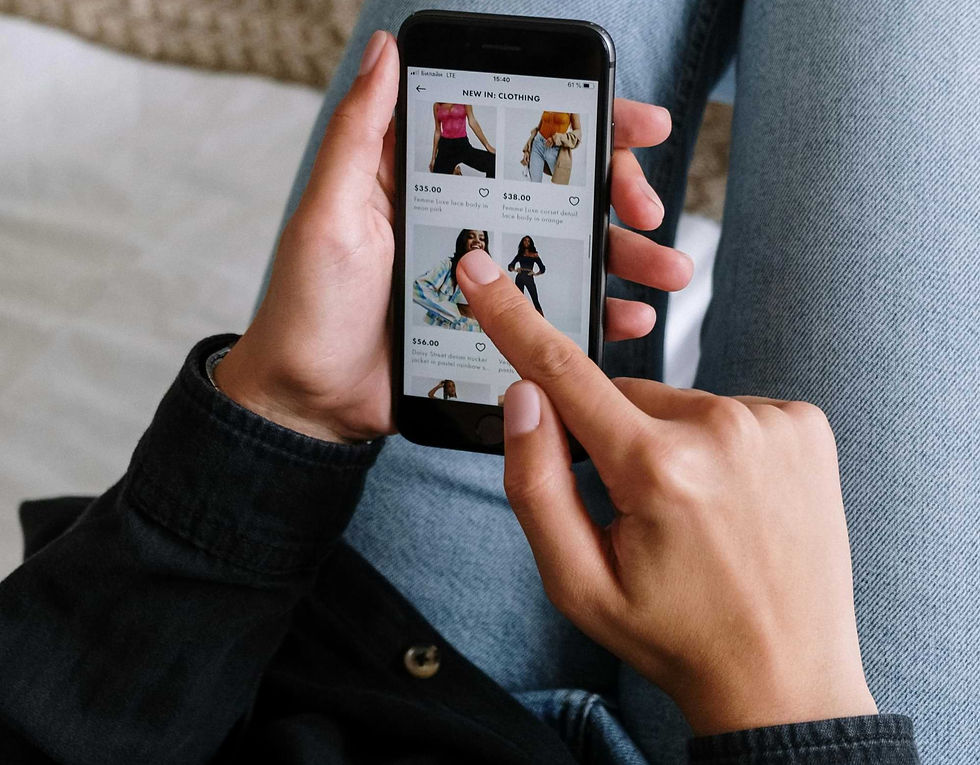 A woman browsing clothing on an e-commerce site using a smartphone.