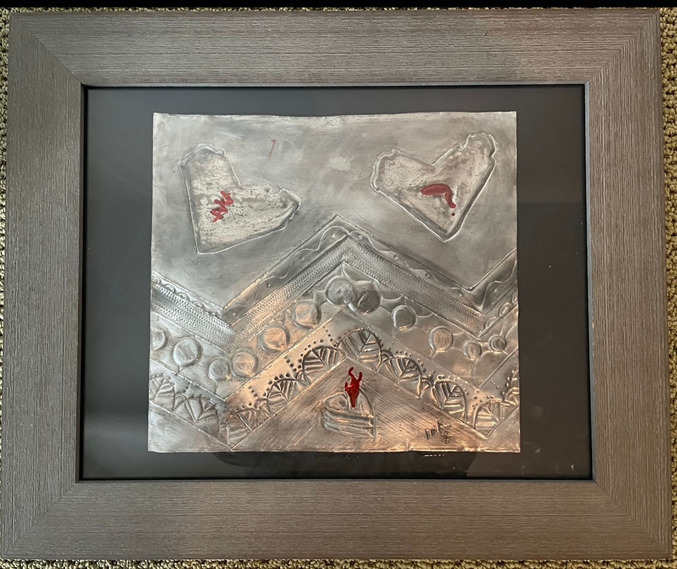Close-up view of a custom metal art piece with intricate floral patterns