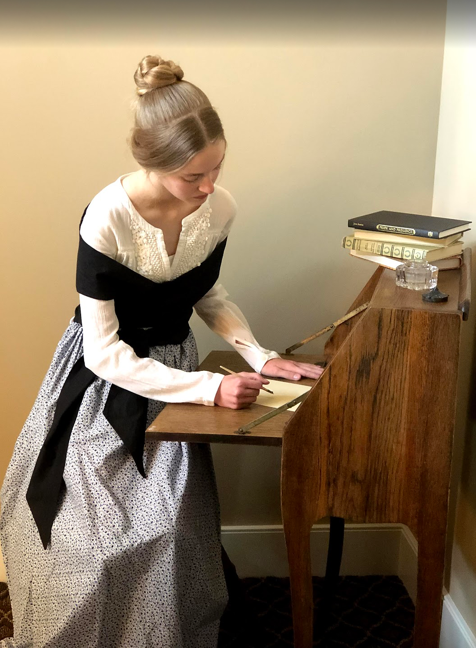 Maizie embodying Austen for her wax museum project
