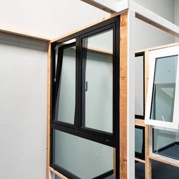 Black tilt-and-turn window in Green Mainland Dallas showroom