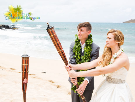 Fire Hawaiian tiki torches at weddings in Hawaii by Aloha Island Weddings
