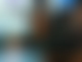 A team of recruiters discussing volume hiring strategies in a modern office setting, highlighting the importance of efficient recruitment processes and technology in attracting top talent.