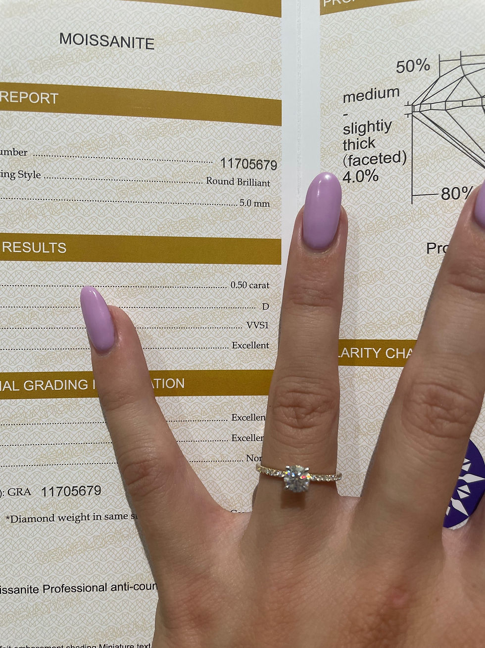 Thumbnail: 0.5 carat round on a pavé band two toned 