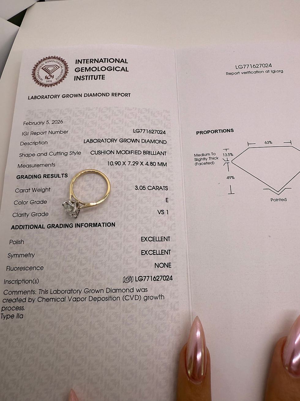 Thumbnail: 3.05 carat E VS1 elongated cushion solitaire with tulip basket and hidden halo 