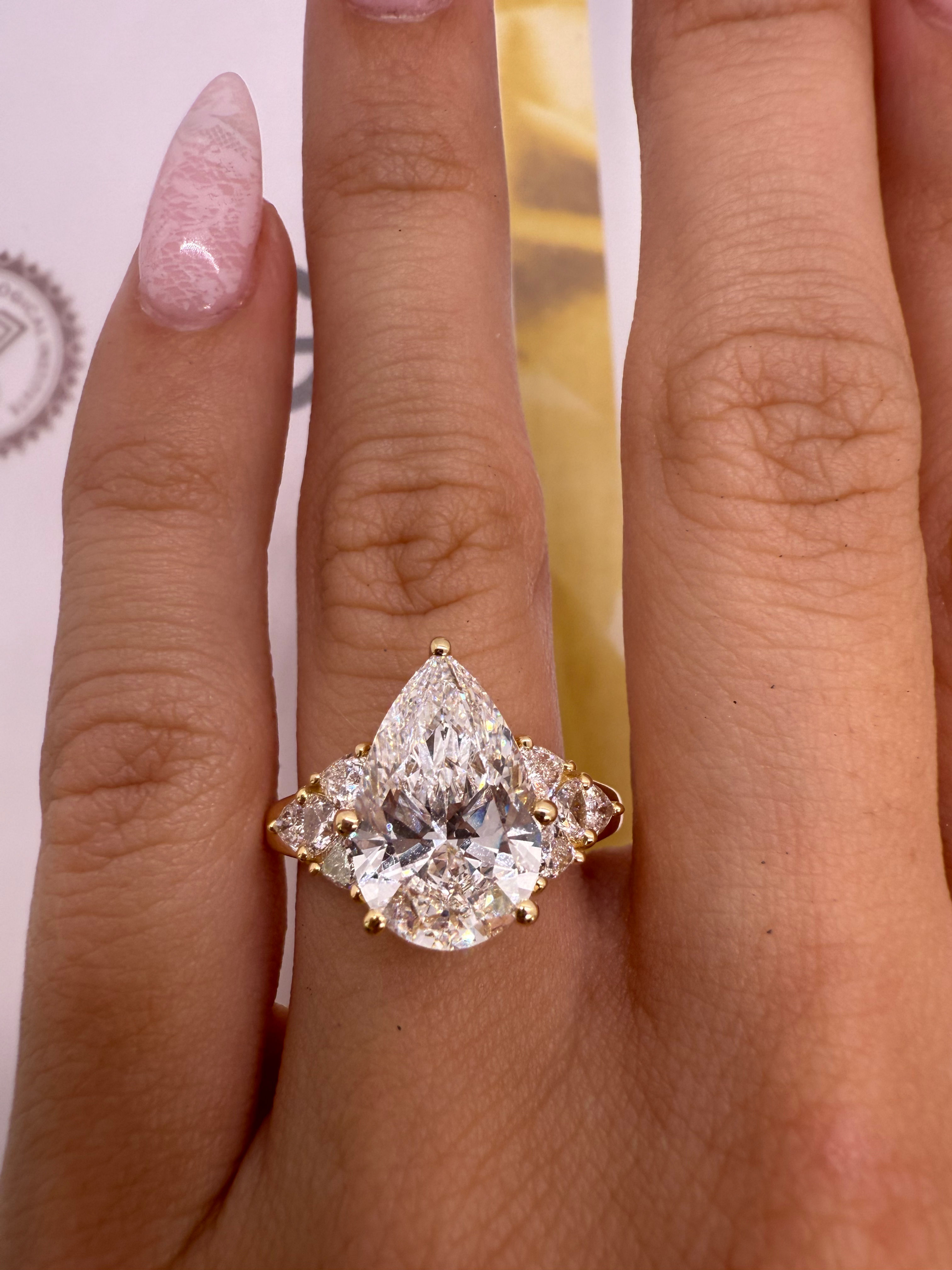 4.04 carat E VS1 pear with trillion side diamonds 