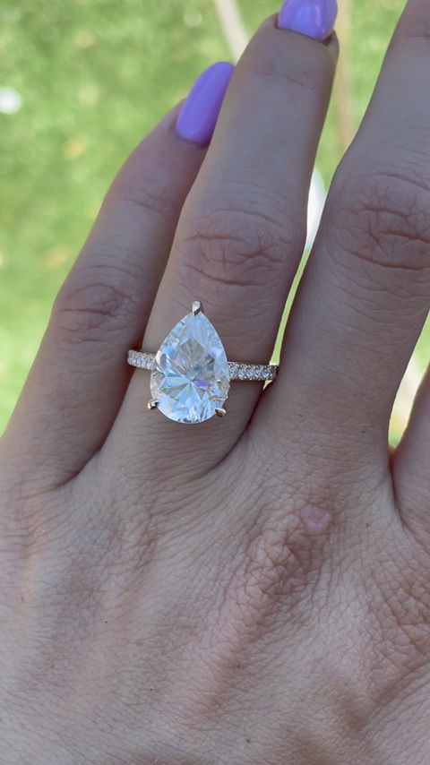 Thumbnail: 5 carat pear moissanite on a pavé band with hidden halo cathedral 14k yellow 