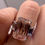 Thumbnail: 5.08 carat fancy pink emerald cut diamond with baguette side diamonds 