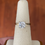 Thumbnail: 2 carat cushion cut moissanite ring with hidden halo 