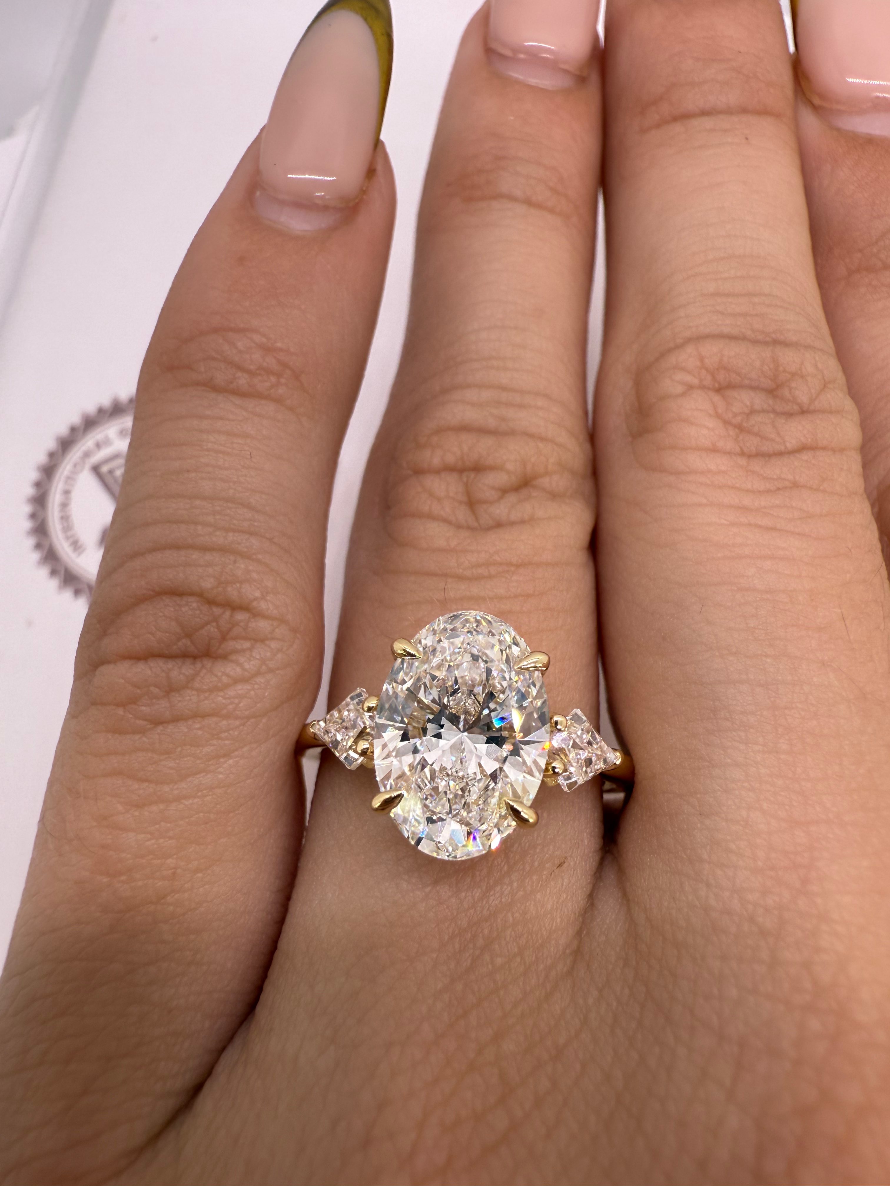 3.03 carat E VVS2 oval lab diamond center stone with kite side diamonds