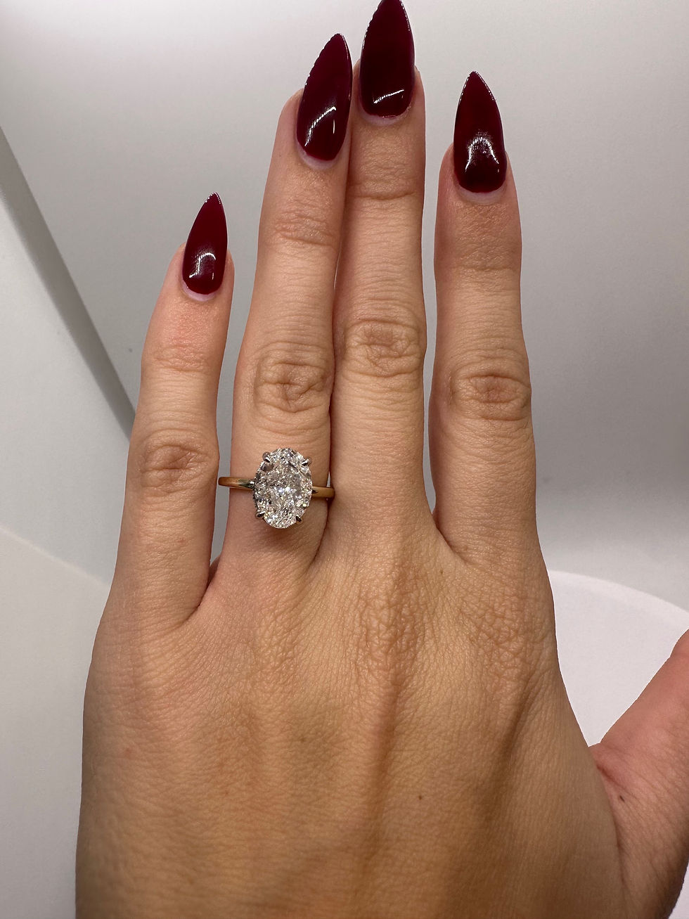 Thumbnail: 3.72 carat G VS1 oval lab grown diamond set in a two toned 14k band 