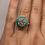 Thumbnail: 3 carat round moissanite with a lab grown emerald halo antique style 