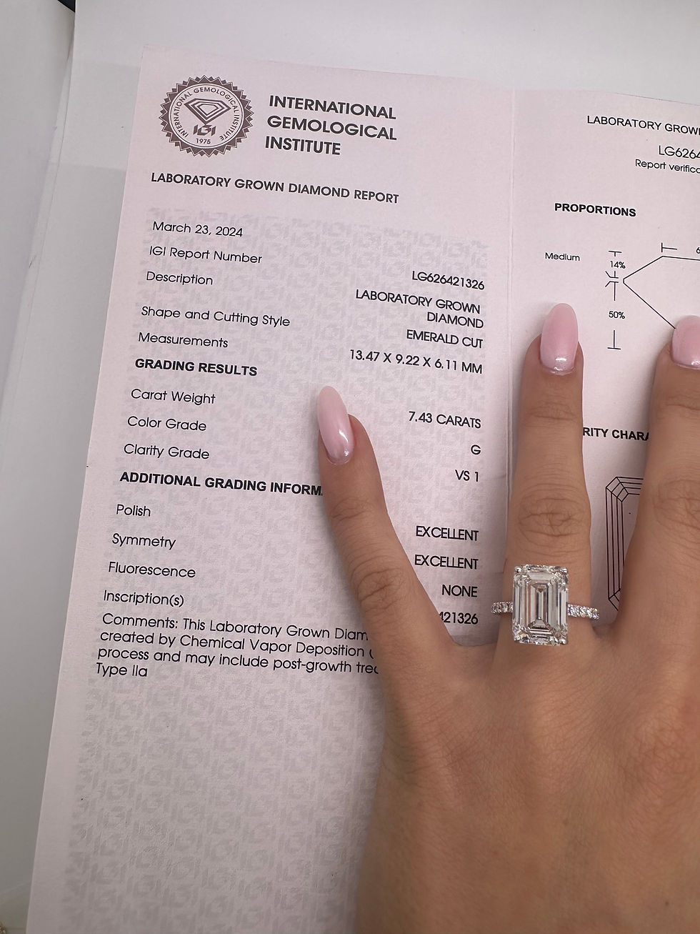 Thumbnail: 7.43 carat G VS1 emerald cut lab diamond on a pavé band 