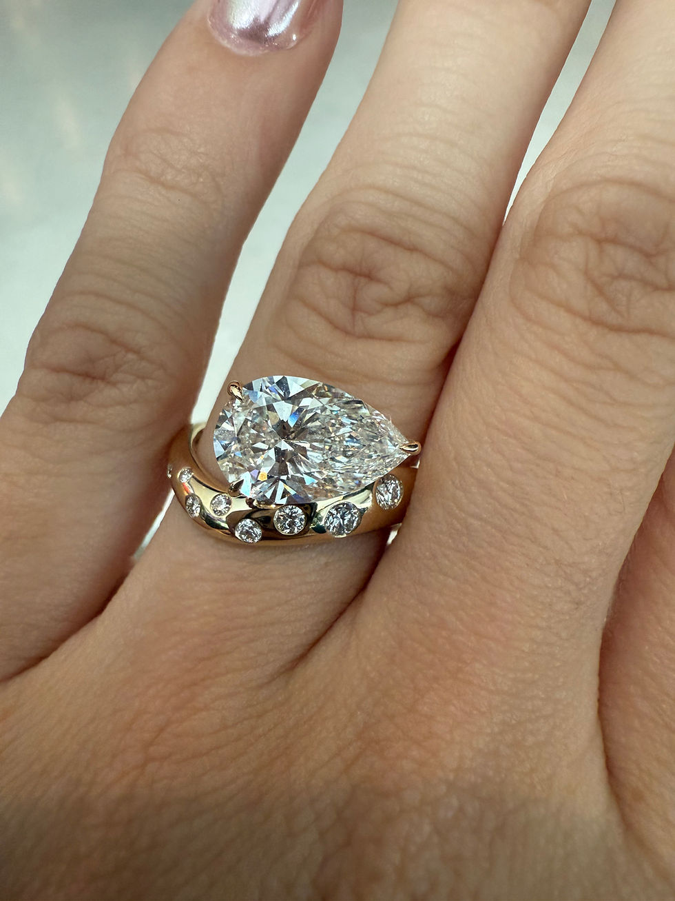 Thumbnail: 3.07 carat F VS1 pear east west with flush set polka dot band 