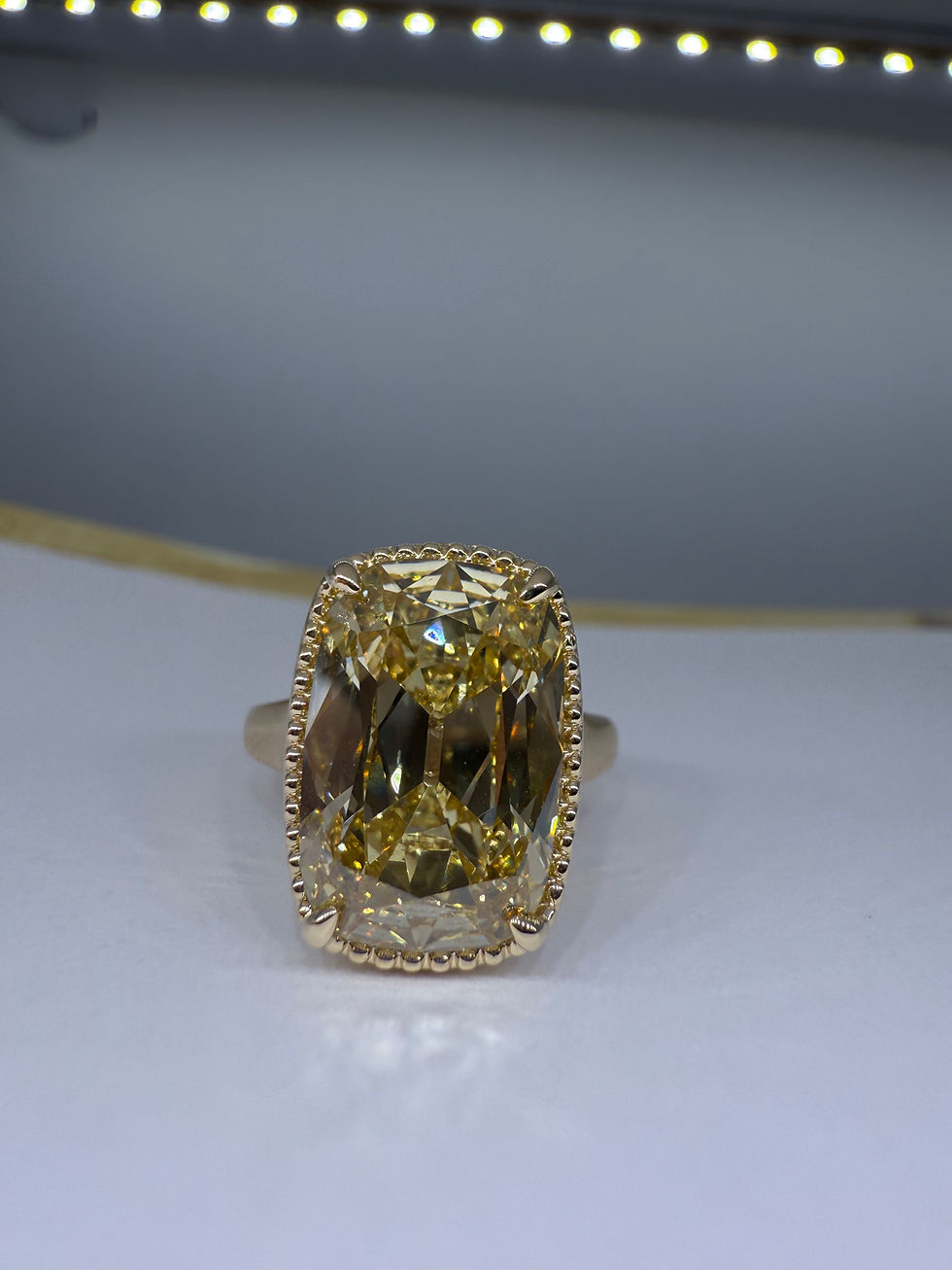 Thumbnail: 6.30 fancy yellow VVS2 antique cut cushion with pave tulip basket and milgrain