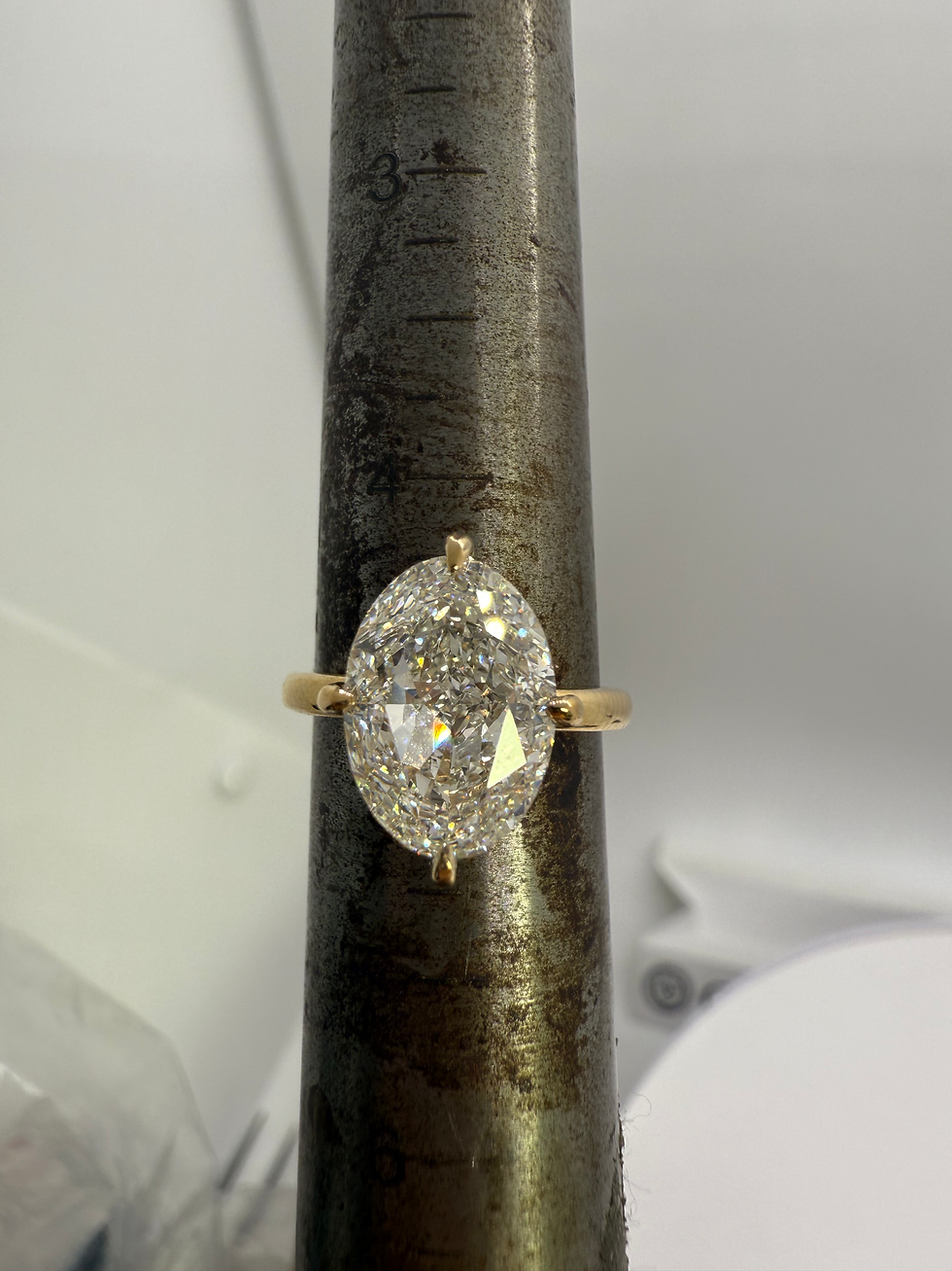 Thumbnail: 4.83 carat G VVS2 crushed ice oval lab diamond with compass prongs hidden halo