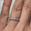 Thumbnail: Low profile moissanite eternity band 10k rose gold