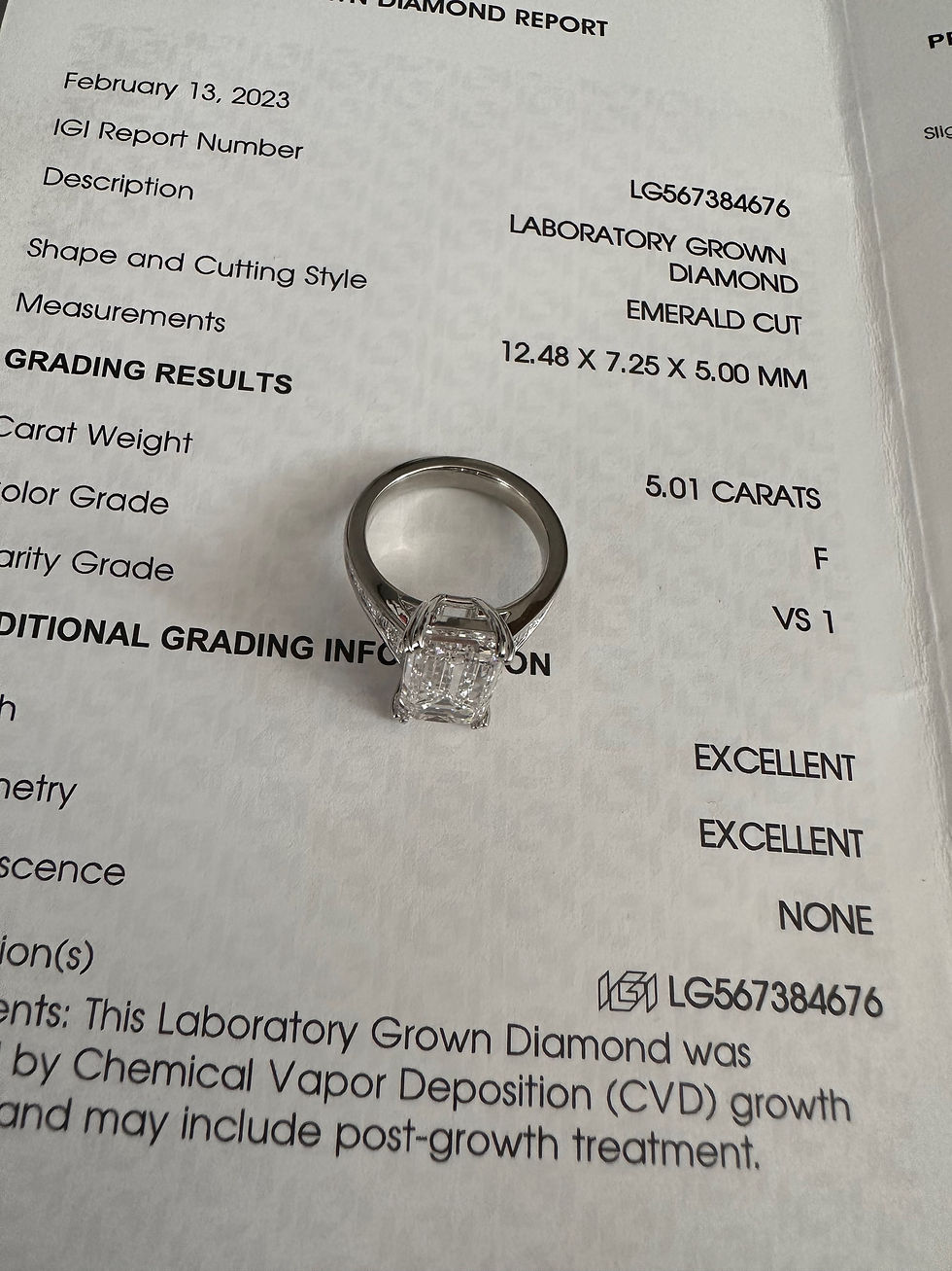 Thumbnail: 5.01 carat emerald cut lab grown diamond on a graduated baguette diamond band 