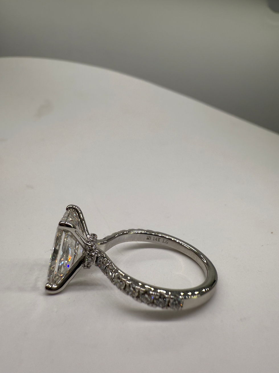 Thumbnail: 4.07 carat G VS2 radiant cut lab diamond on a pave band with hidden halo collar