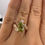 Thumbnail: 2.11 carat fancy vivid green VS2 pear lab diamond leafy style bypass ring 