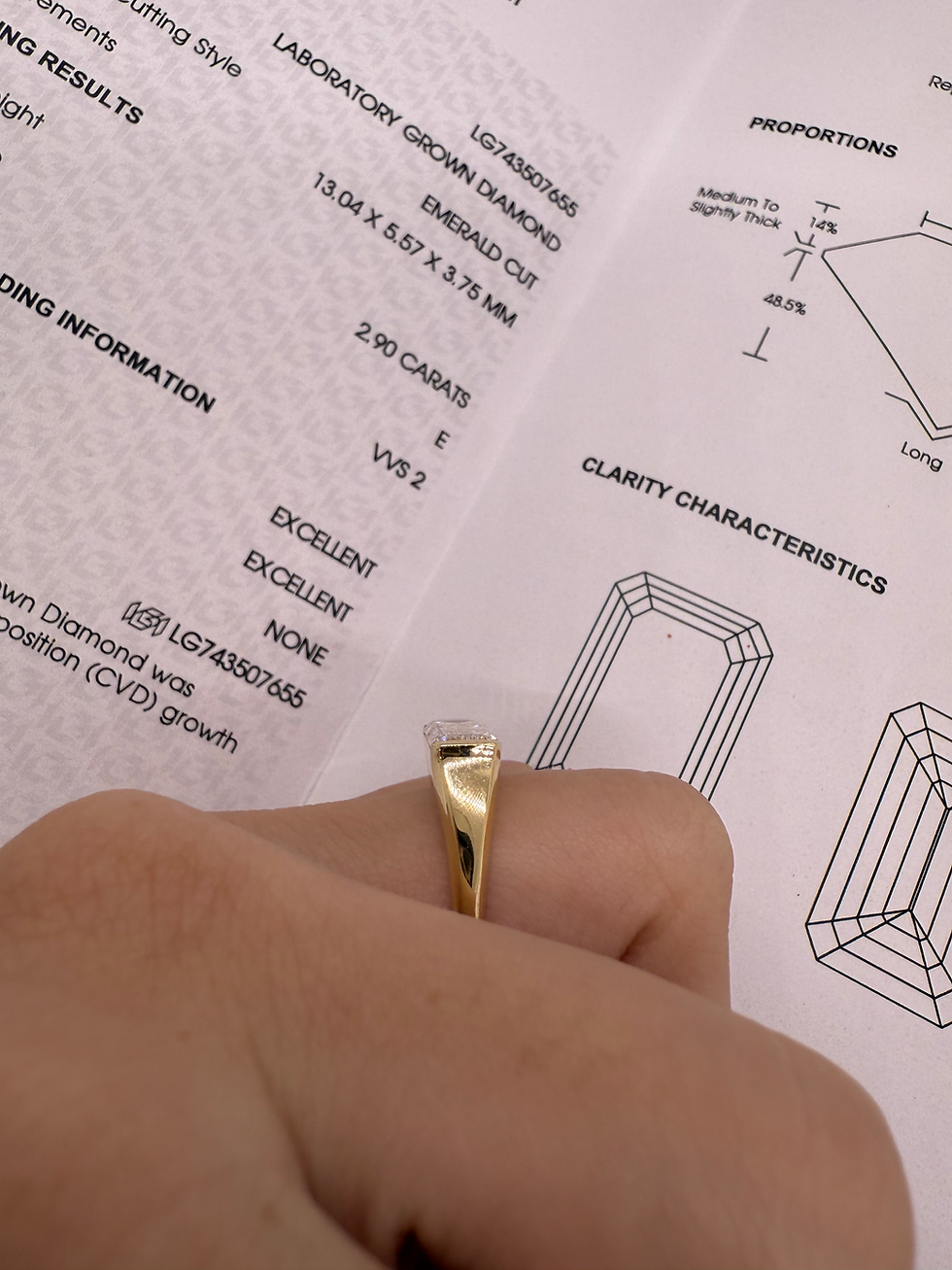 Thumbnail: 2.90 carat e VVS2 east west emerald cut lab diamond half bezel 