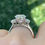 Thumbnail: 3 carat oval cut moissanite ring with half moon side stones
