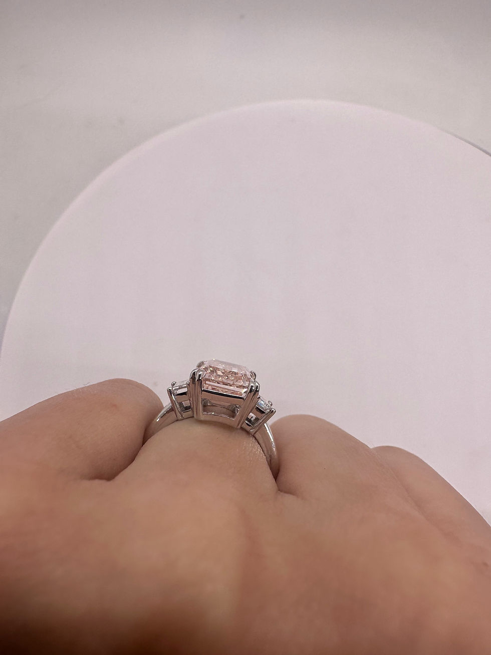 Thumbnail: 5.08 carat fancy pink emerald cut diamond with baguette side diamonds 